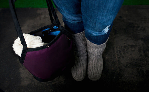 A skein of yarn in the Little Swift.